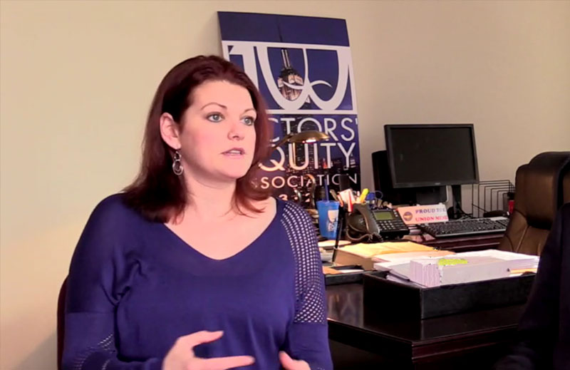 Kate Shindle being interviewed in her New York AEA office (video screen capture courtesy of Broadway World)