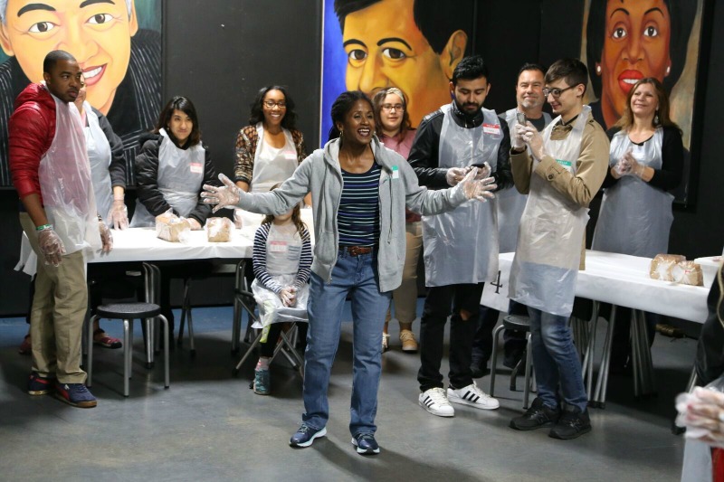 Bahni Turpin as Regina , with ensemble and members of the audience in fellowship at Cornerstone Theater (Photo by Brian Biery)